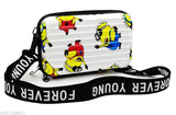 A multi-colored sling bag with cartoon character prints on a light background, featuring a shoulder strap
