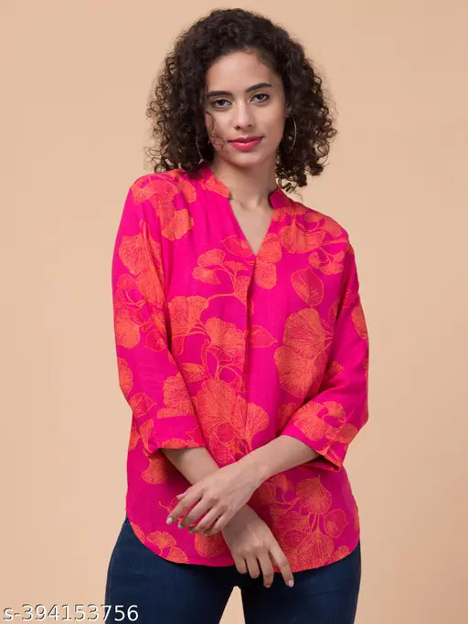 Fuchsia pink floral rayon slub sleeve top with 3/4 sleeves, vibrant print, pleated front, and country of origin: India
