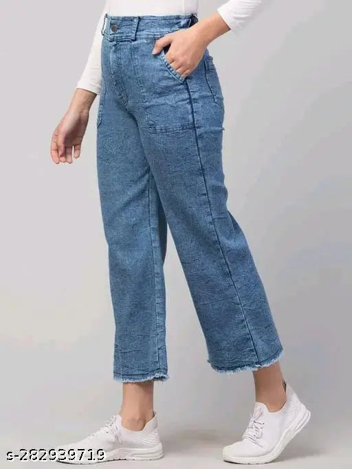 Blue denim cargo pants with rolled-up legs, side pockets, and belt loops