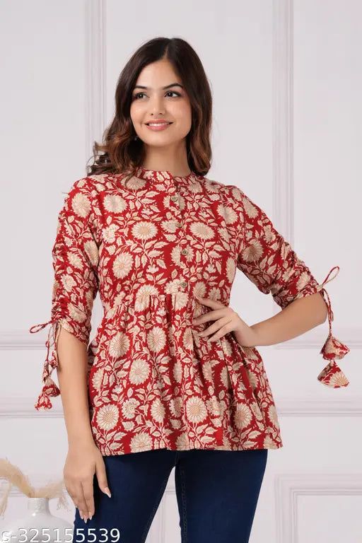 Maroon printed cotton designer top with mandarin collar, 3/4 sleeves, and pleats. Women's ethnic wear in soft colors for regular wear, tailored from Indian cotton." (109 characters)