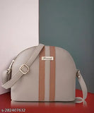 A black faux leather purse with a zipper closure, designed for women or girls
