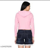 Pink cotton blend solid crop hoodie for women, stylish long sleeve top with matching T-shirt on clothing rack