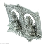 Artisanal metal statue of Lord Ganesha and Lord Laxmi in a silver frame, with intricate designs