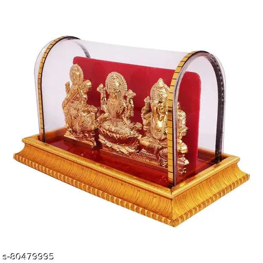 Handcrafted gold-plated brass figurine of Laxmi, Ganesh, and Saraswati for home decor, 10cmx10cmx10cm