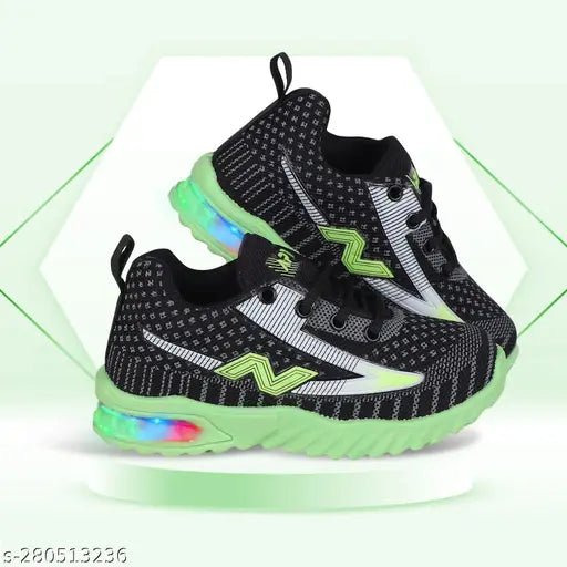 Black, white, and green kids' athletic sneakers with colorful LED light accents