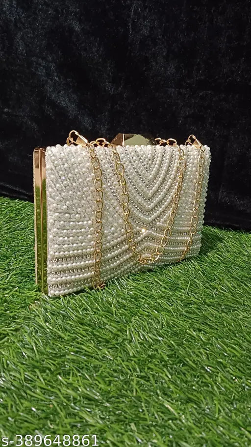 White pearl beaded clutch with a gold chain strap