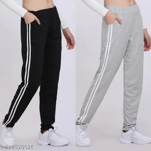 Black, grey, white sneakers paired with black and white striped joggers