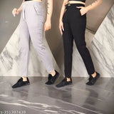 Multi-colored women's athletic track pants, with solid grey and black legs