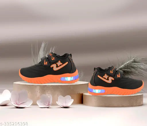 Black and orange LED casual shoes with velcro closure, designed for kids' outdoor sports activities