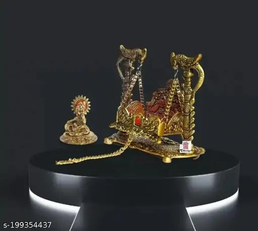 Gold showpiece with intricate details, possibly a deity or idol figure