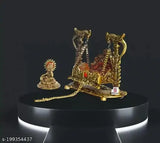 Gold showpiece with intricate details, possibly a deity or idol figure