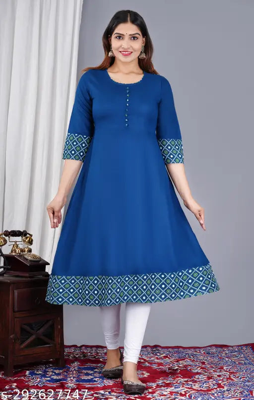 Rayon flared printed kurta with three-quarter sleeves, solid combo. Indian traditional wear for functions, festivals, parties, and weddings. Sizes: S (36in bust, 48in length), M (38in bust, 48in length), L (40in bust, 48in length). Elegant and comfortable design