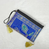 Blue fabric clutch with tassel, black zip closure