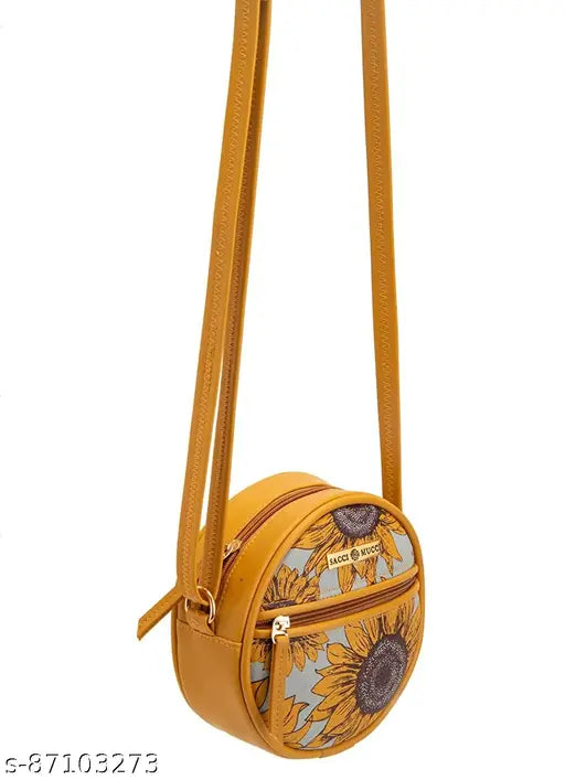 Round woven straw bag with floral design and brown leather trim