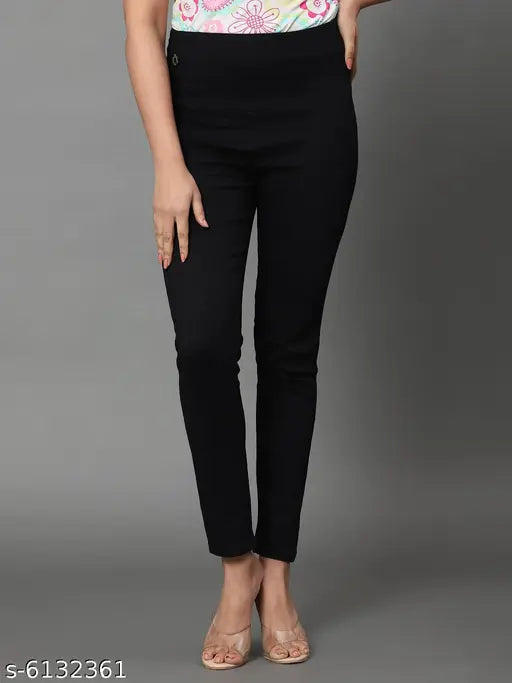 Solid black denim jeggings with high waist, skinny fit, and elastic closer - women's style from India