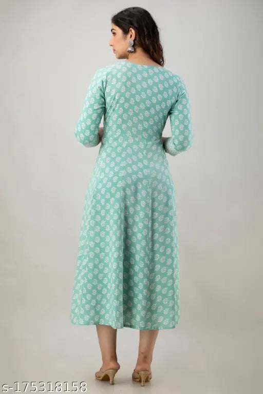 The image displays a long-sleeve, knee-length kurta with flared lace hemline in a blue pattern on a woman