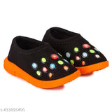 Brightly colored shoes with a pattern of circular color shapes, likely neon or pastel colors, designed for babies