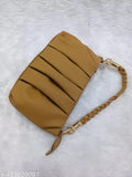 Beige suede cross body sling bag with a chain strap