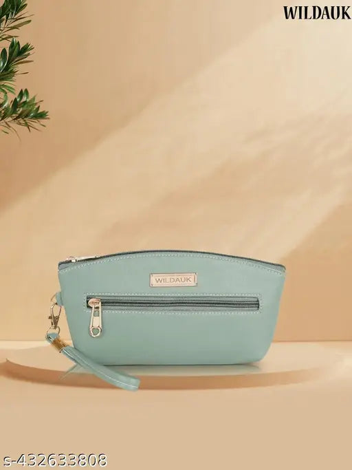 A sea green clutch purse with multiple pockets and slots