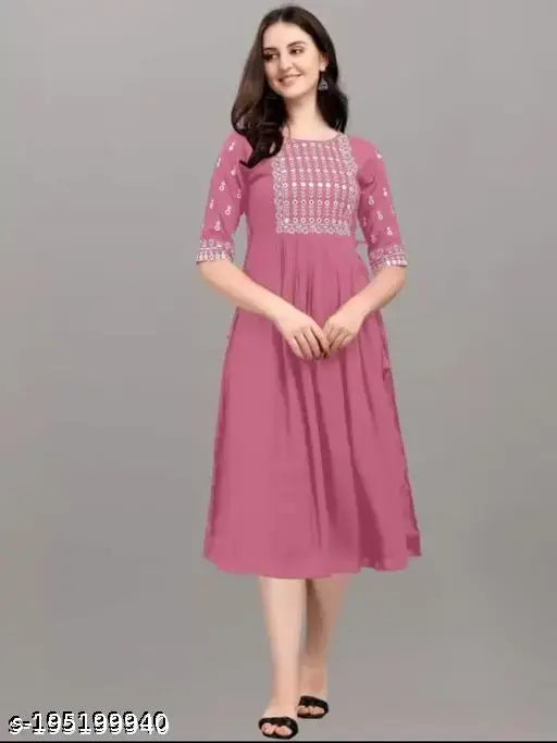 Pink rayon anarkali kurta with embroidered pattern, three-quarter sleeves, suitable for women sizes S to XXXL. Indian traditional outfit on mannequin