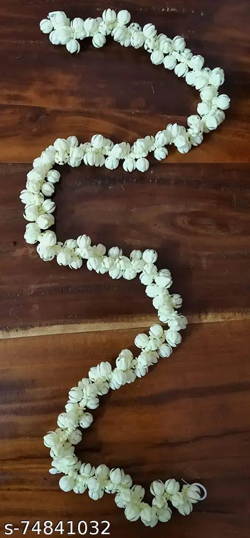 Handmade white polyester mogra garland, 5ft long, ideal for home/office decoration. Perfect for Diwali festive decor and adding a natural touch to interiors. Made in India by BS AMOR
