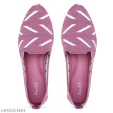 Pink satin fabric shoe with white geometric pattern on top of it