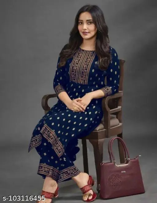 Rayon printed net kurta and palazzo set with three-quarter sleeves. Beautiful ethnic wear for women from India
