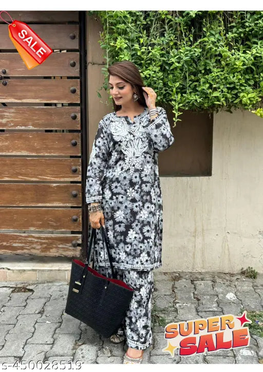 Black cotton printed Chikankari kurta and palazzos, traditional Indian women's outfit with long sleeves, vibrant chikankari work on black fabric