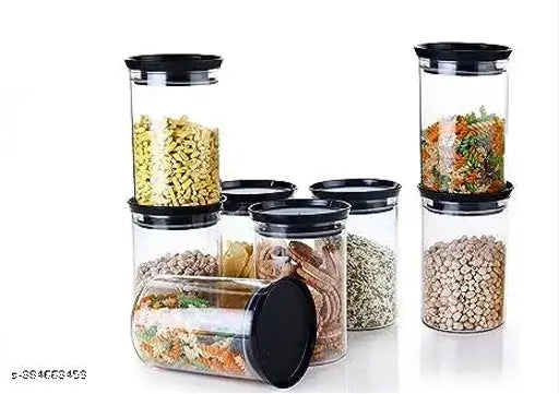 Pack of 8 black plastic storage containers for kitchen, set of four with lids and four without, containing assorted food items including rice, masala, pasta, spices, and pulses