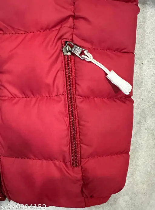 Red puffy kids winter jacket with zip closure and drawstring hood