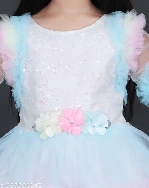 Light blue tulle dress with pastel pink flower applique, ribbon waist detail