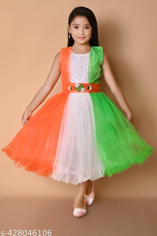 Red and green party dress, ruffled, flared skirt, young girl wearing, celebrating independence day