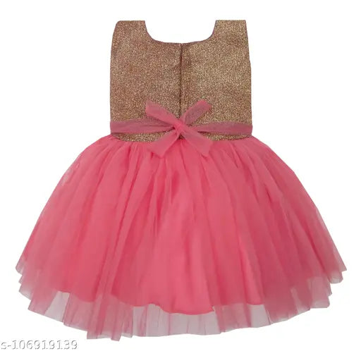 Pink, glittery skirt dress with a silver bodice and a pink bow