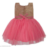Pink, glittery skirt dress with a silver bodice and a pink bow
