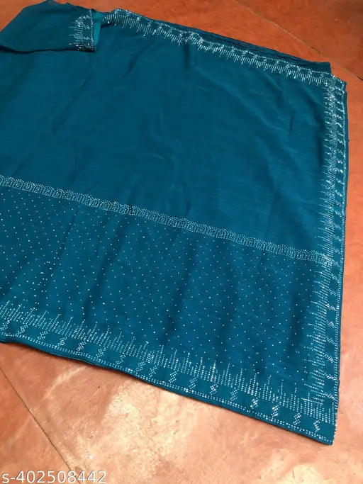 Dark blue sari with sequin borders and intricate designs featuring small sparkles