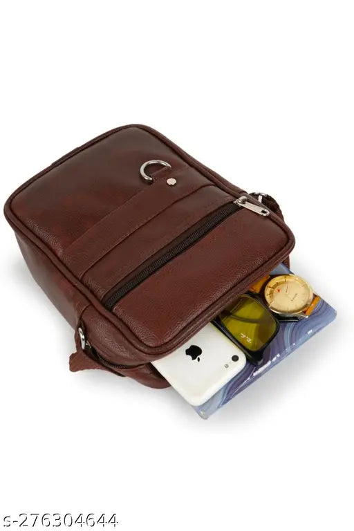 Brown synthetic vegan leather sling bag with strap