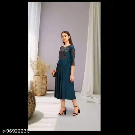 Refined dark blue kameez with flared bottoms, embellished neckline and cuffed sleeves