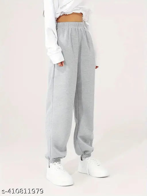 White sneakers, casual grey jogging pants with drawstring waistband
