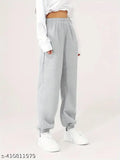 White sneakers, casual grey jogging pants with drawstring waistband