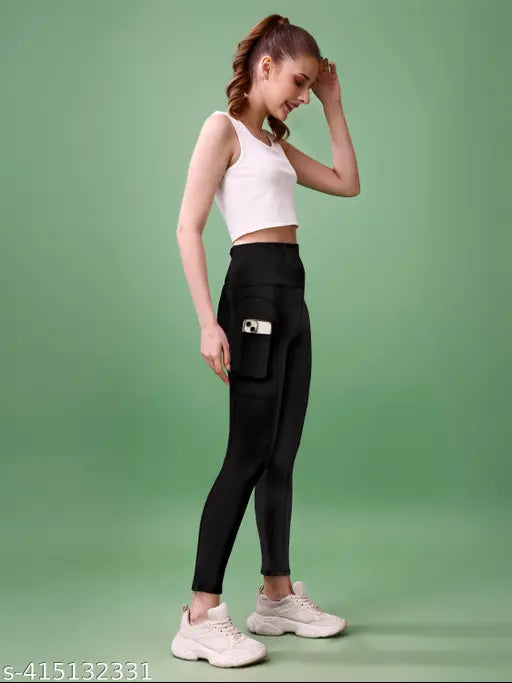 Black polyester self-design net high waist active tights for women, gym, yoga, sports, and dance. Comfortable, stretchable, breathable, and non-see-through bottomwear. Available in S, M, L, XL, XXL, XXXL sizes from India