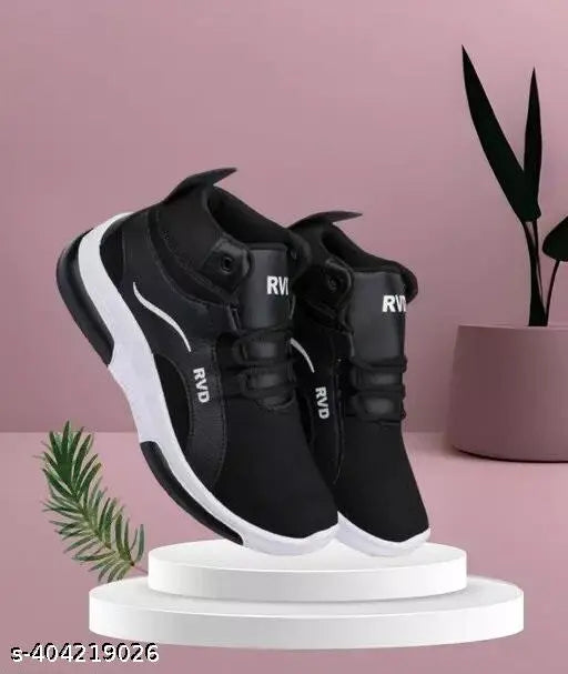 Black and white sports sneakers for boys, featuring a lace-up front, suitable for casual wear