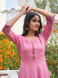 Women's rayon polka dot printed flared kurti with three-quarter sleeves, vibrant print on a traditional Indian outfit