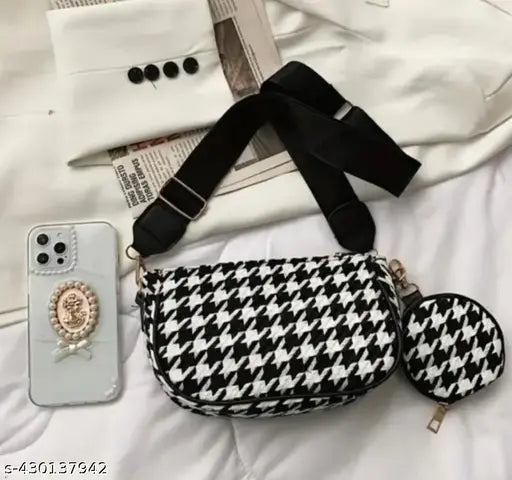 Women's fashionable black and white houndstooth pattern sling bag with adjustable shoulder strap, multiple compartments and a phone case pocket