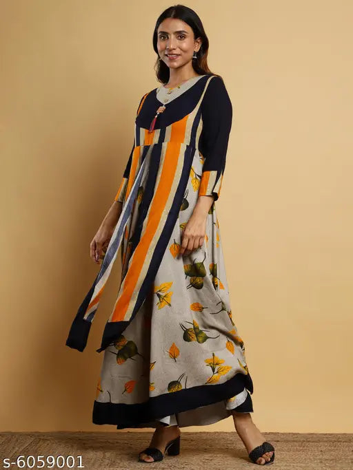 A woman in an orange and black striped kameez