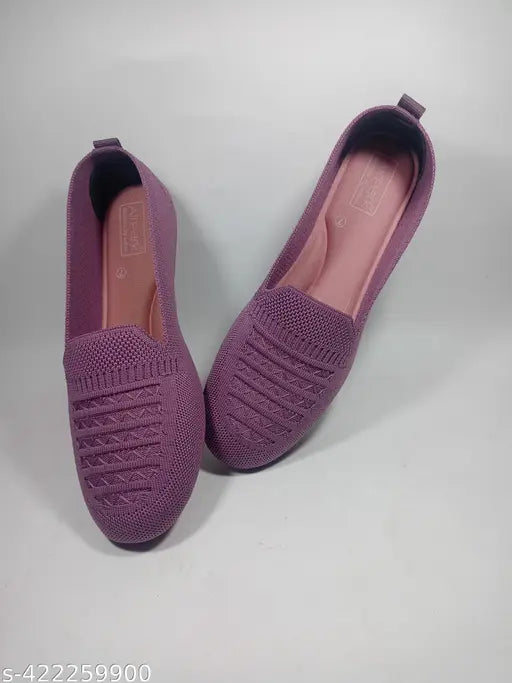 Purple knit slip-on shoes. Comfortable, stretchy material.