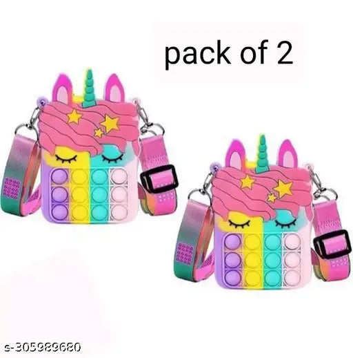 The image shows a pair of cute, multicolored faux leather purses with rainbow unicorn motifs, each featuring a whimsical pink unicorn face on a clear strap and a shiny golden coin purse lining. They are designed in the style of Popit bags, which pop open to reveal a hidden pocket inside. The purses come in two colors: one with pink and blue unicorn patterns, the other with purple and blue