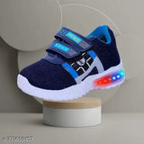 A pair of blue shoes with blue and white laces, a vibrant red light on the sole, and a playful design