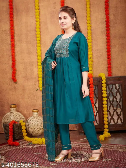 Dark Green Silk Embroidered Salwar Suit for Girls, A-line trousers with three-quarter sleeves, sequin thread embroidery and gota work. Modern wardrobe essential by Aarika. Comes in sizes: 10-11 years (35in/33in), 12-13 years (37in/35in), 14-15 years (39in/37in), 15-16 years (40in/39in). Made in India