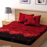 Black and white striped comforter with heart patterns on a bed