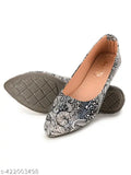 Black synthetic ballet flats with lace-up detail and metal bow clasp, comfortable and stylish for daily use